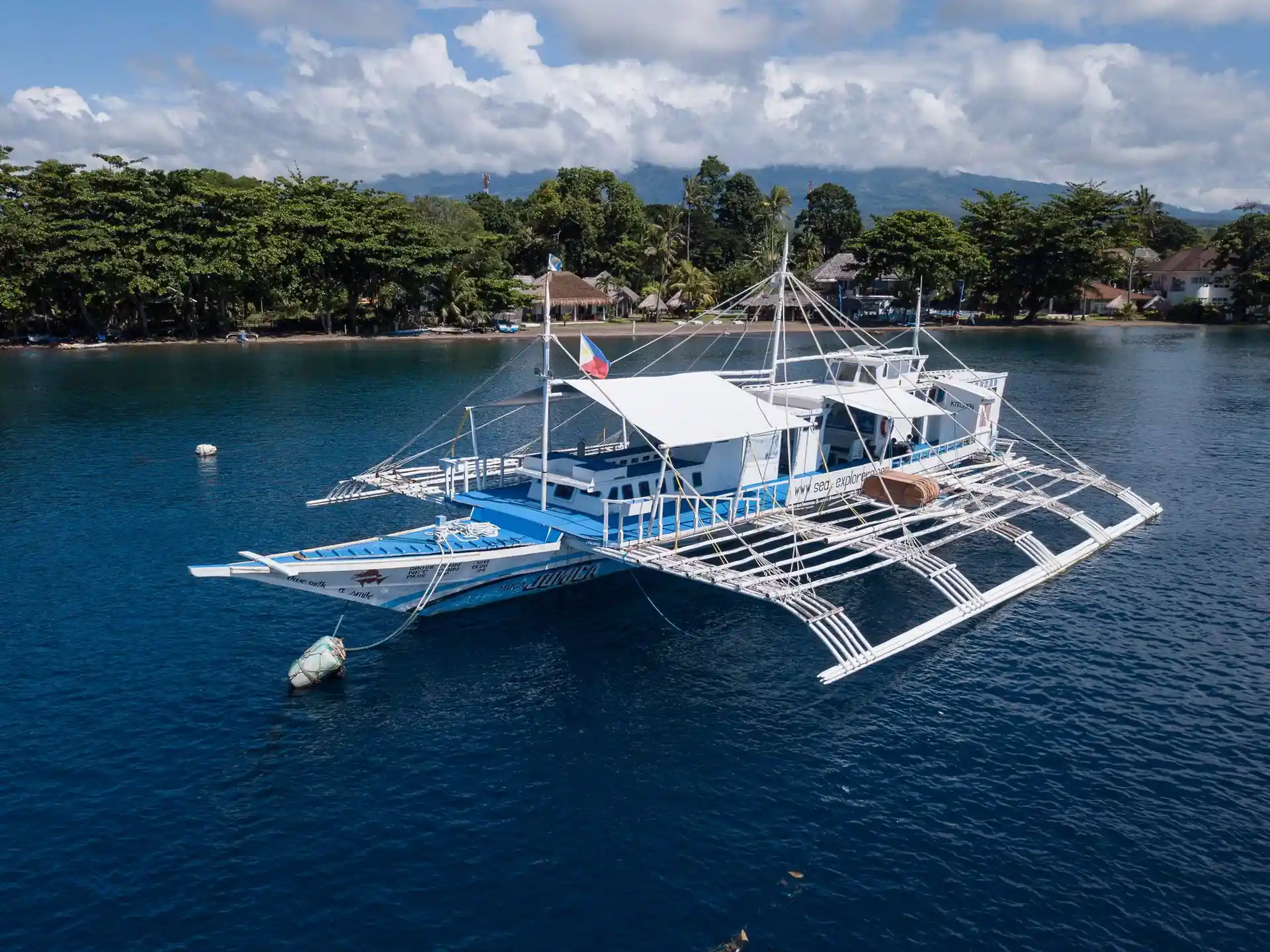 Immerse in SCUBA diving wonders at Sea Explorer's in Dauin, Negros Oriental, Philippines. Experience the thrill as a discover scuba diver explores a vibrant tropical reef. Dive into adventure with PADI-certified instructors at Sea-Explorers.com!