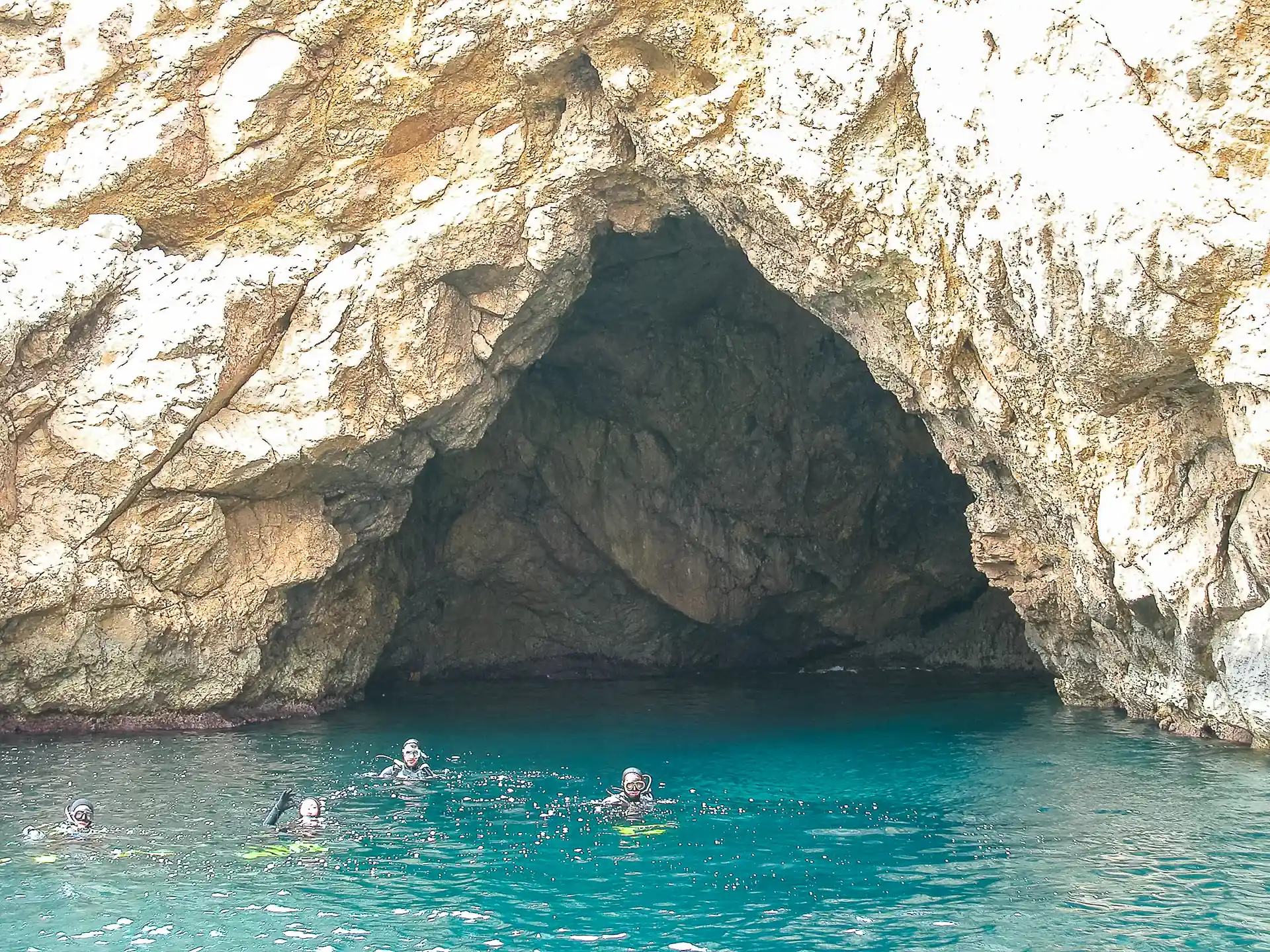 A sea cave awaits in the heart of a marine reserve, where adventure begins beyond the waves.