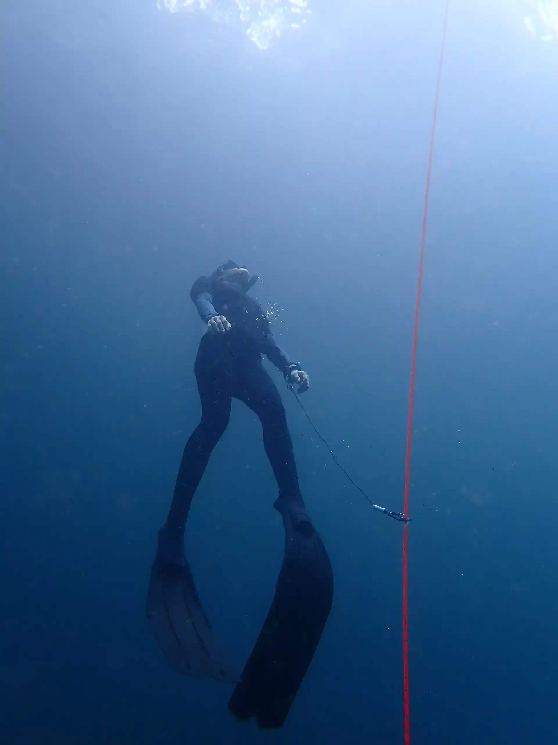 Freediver ascending from a dive