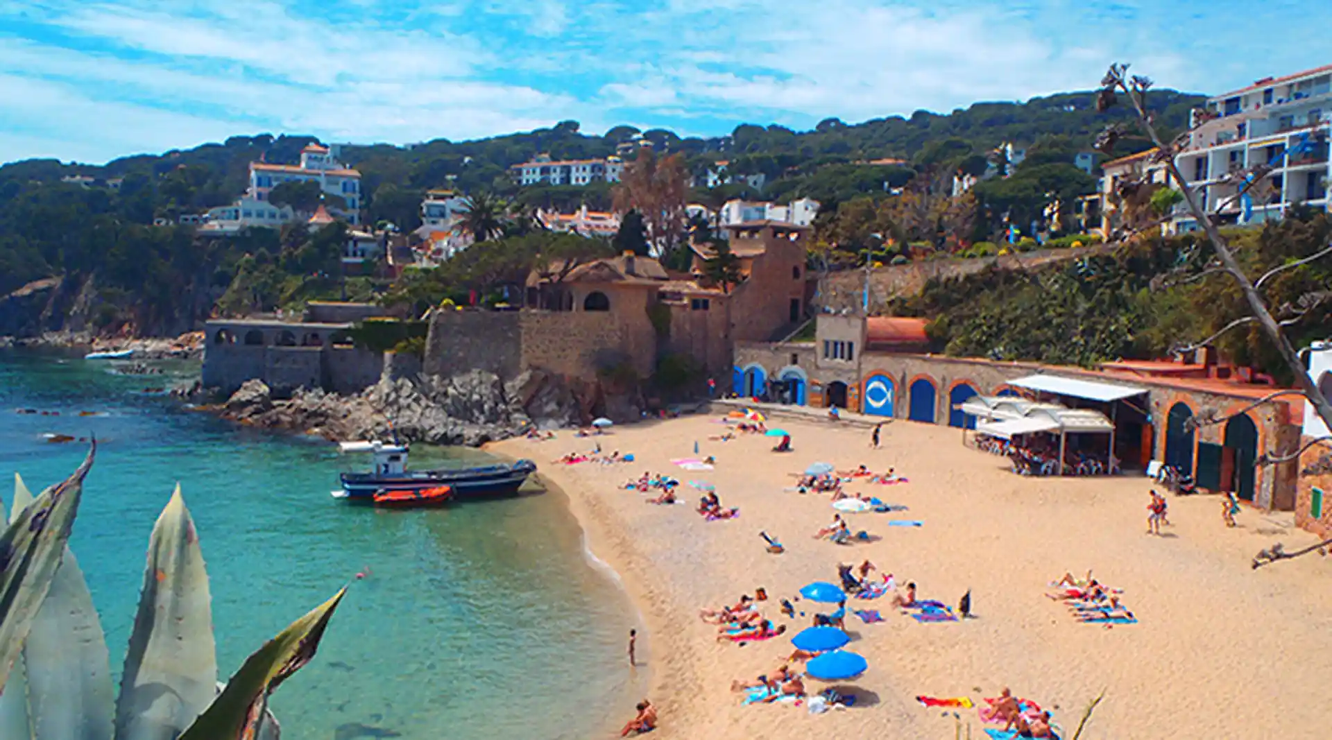 Our dive center on the beach and dive boat waiting for divers