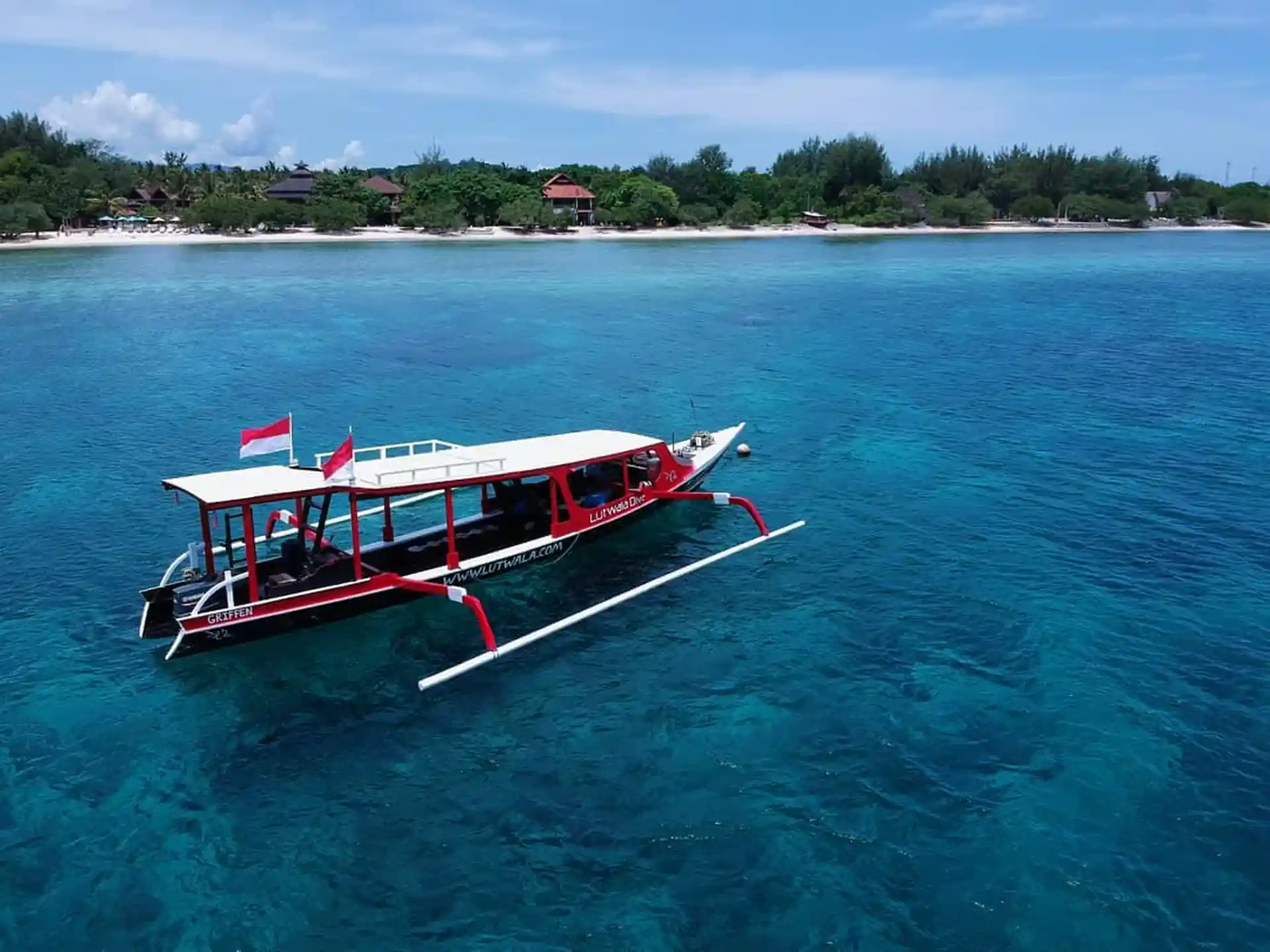 Our boat drifting above Halik, our favourite and nearest dive site.