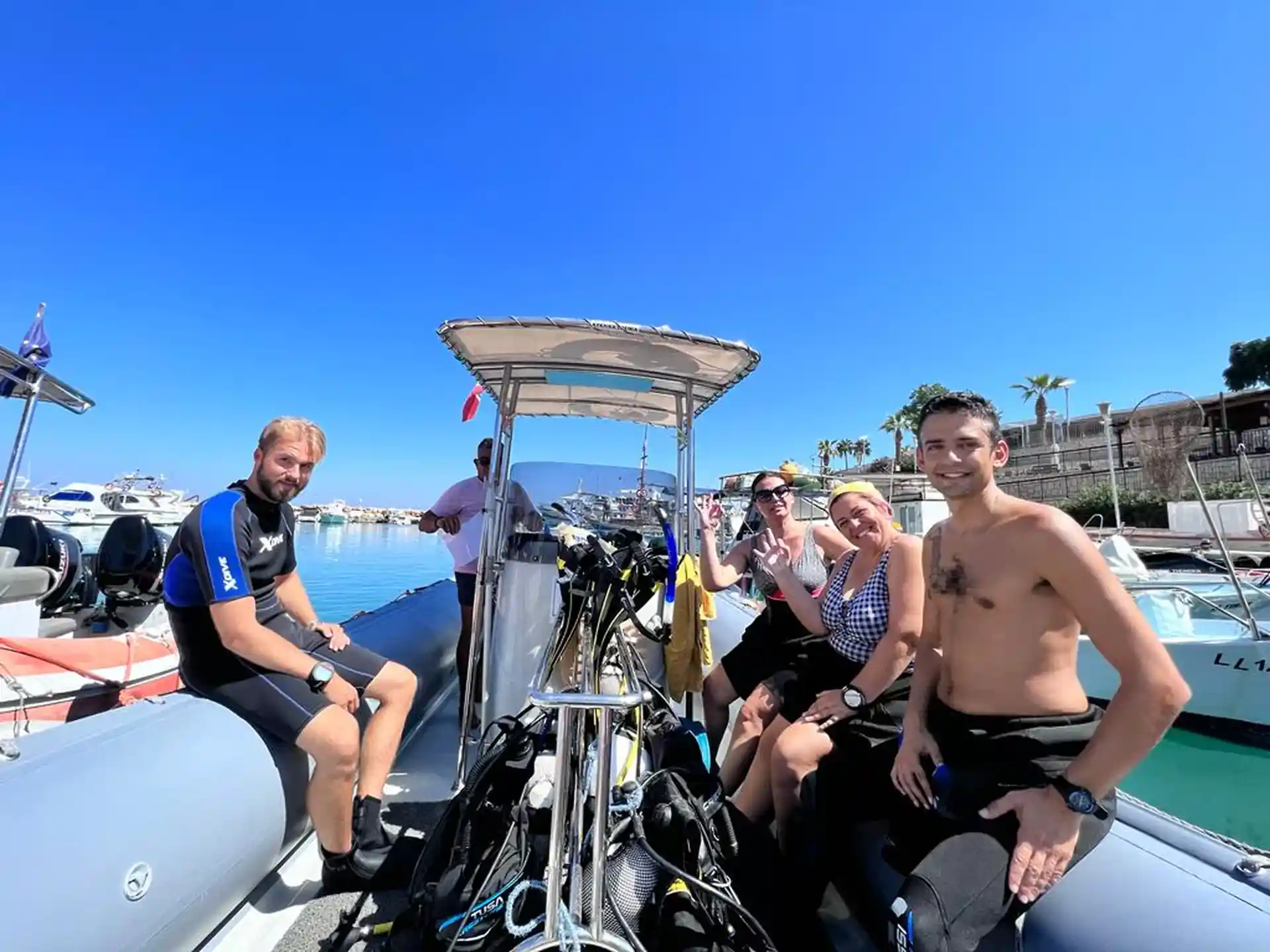 Open Water students heading to their dive site—smiles, sun, and top-tier dive training