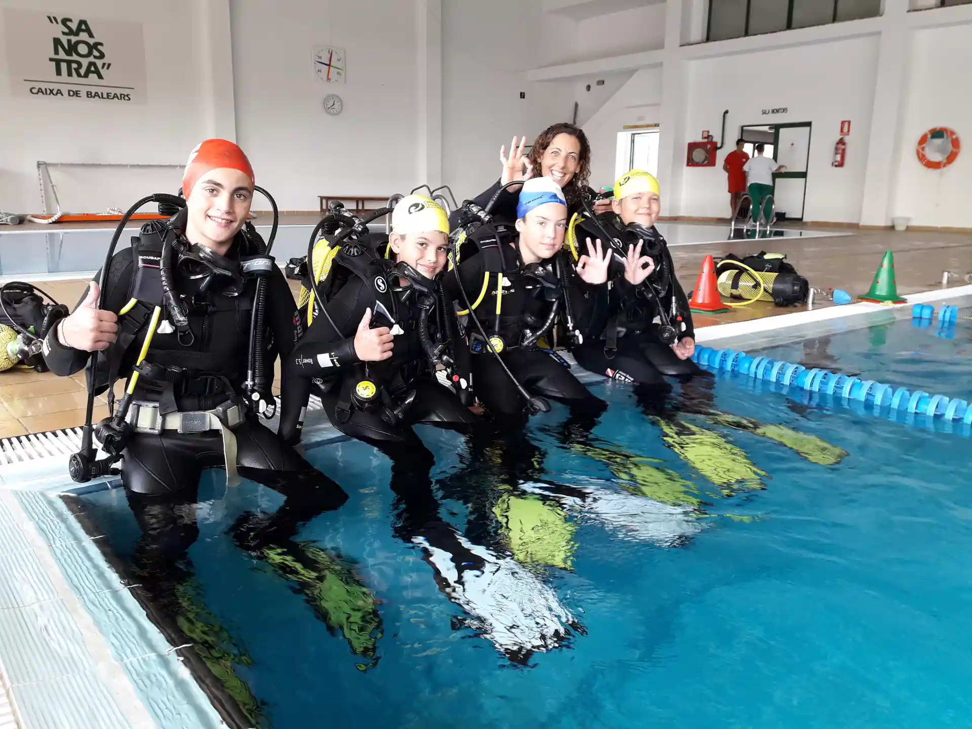 Moments before their very first session - students ready to take the plunge into the pool and begin their underwater journey.