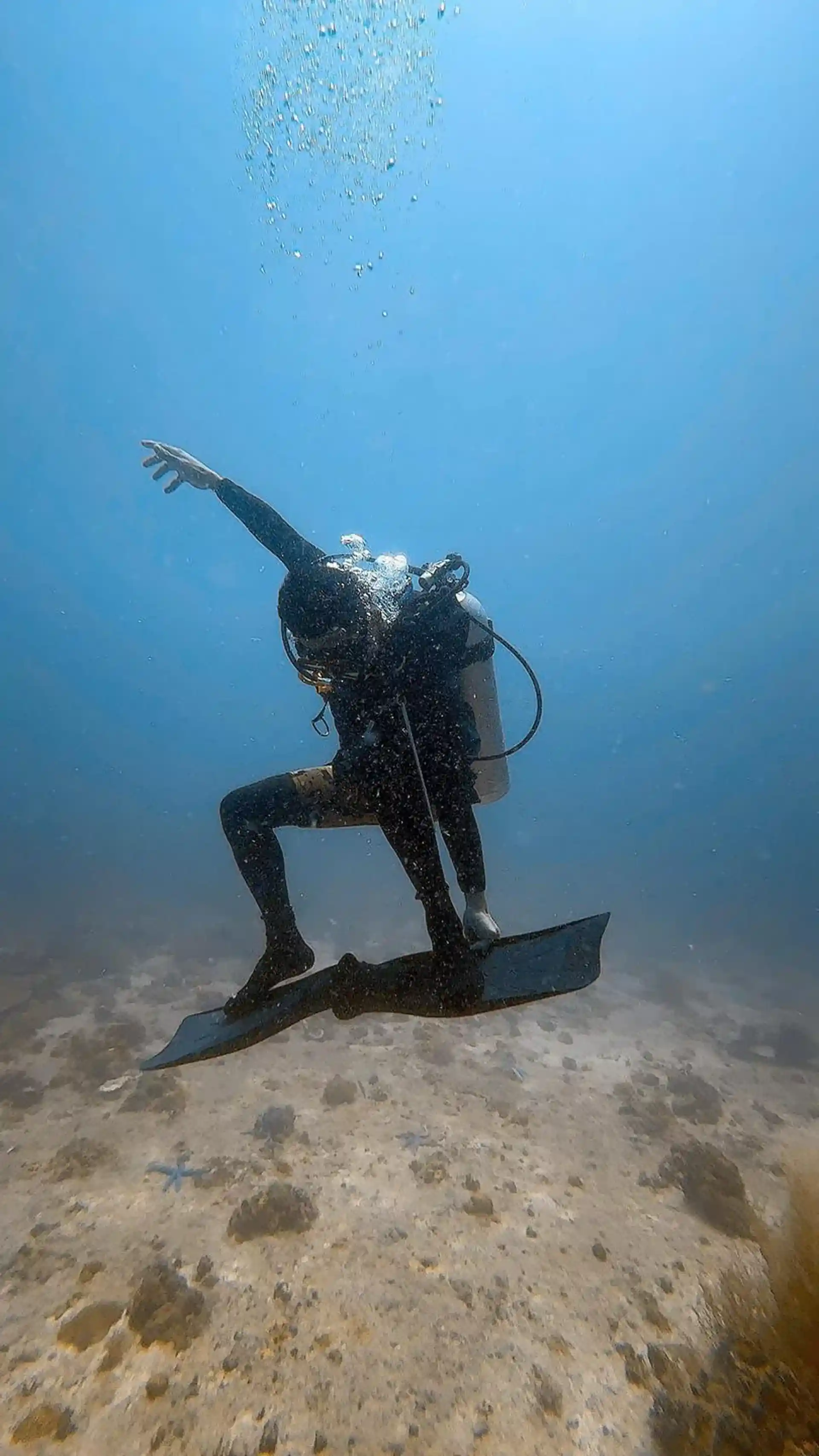 Scuba Diver surfing his fins
