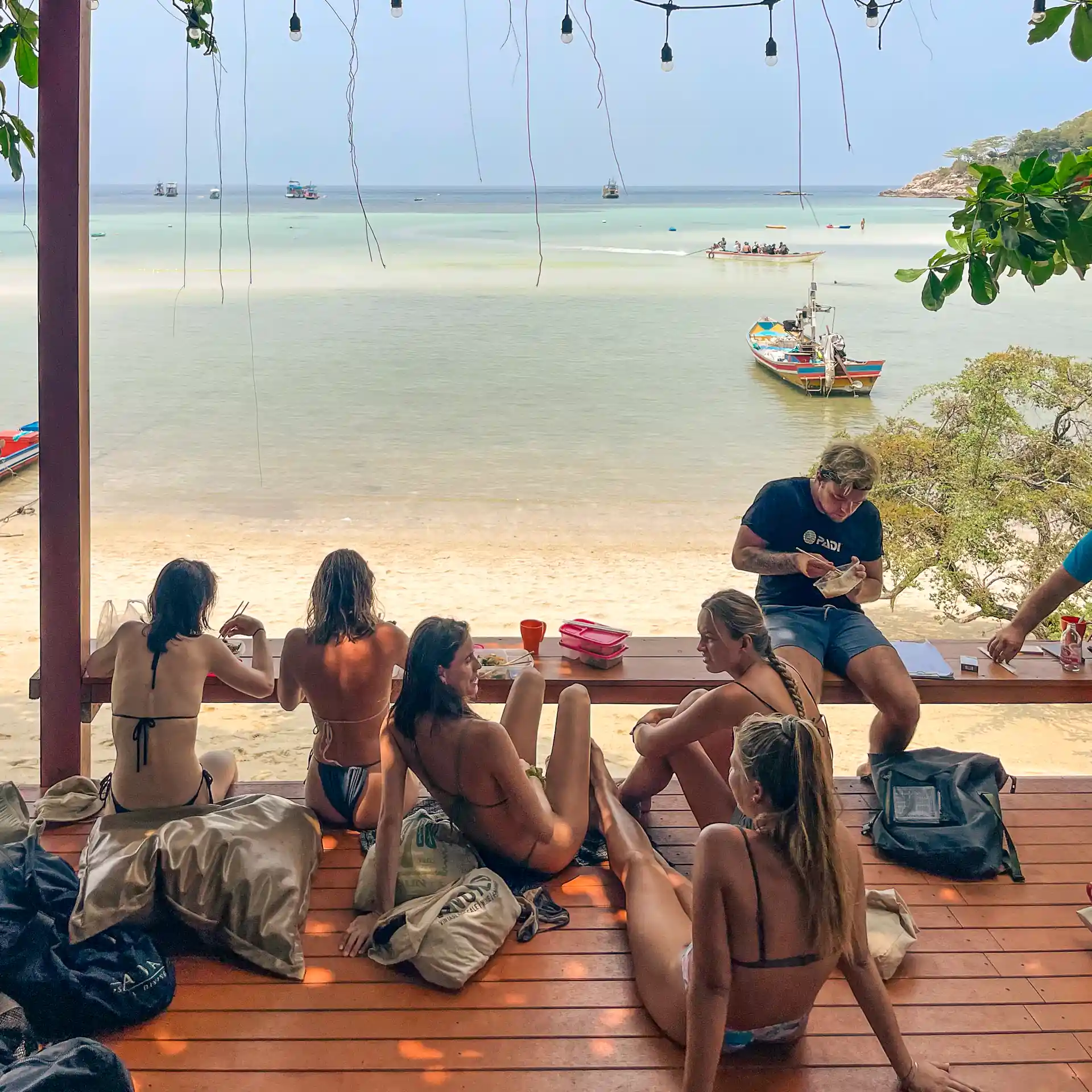 Relax after an unforgettable day of scuba diving in Koh Tao on our beachfront deck with breathtaking sunset views.