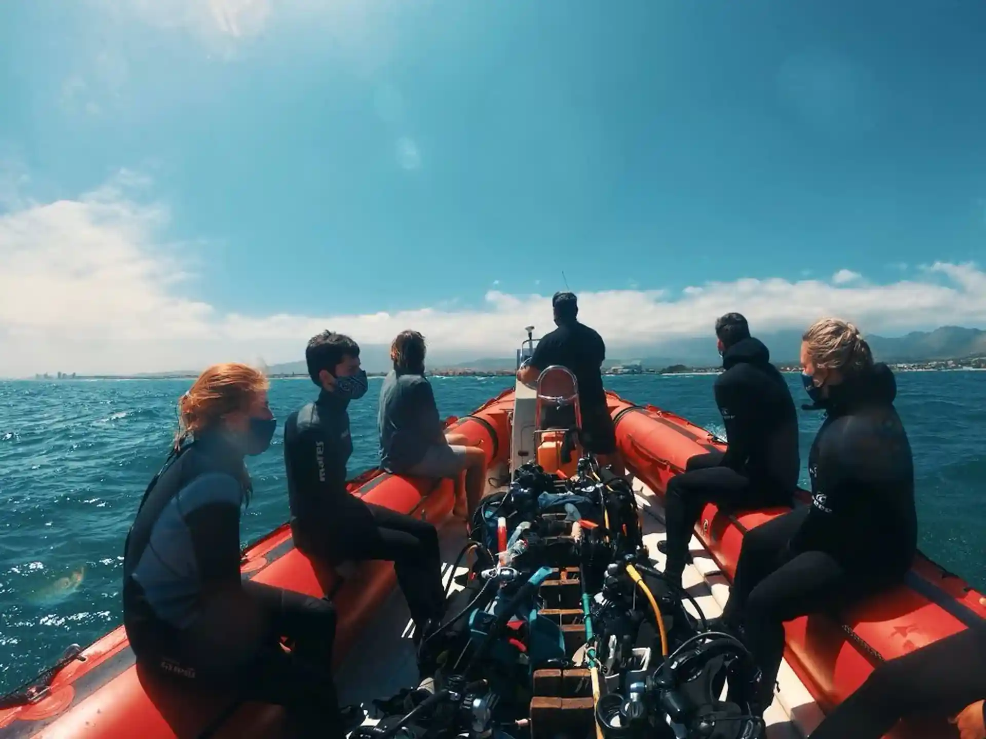 Divers on their way to a dive site with the boat