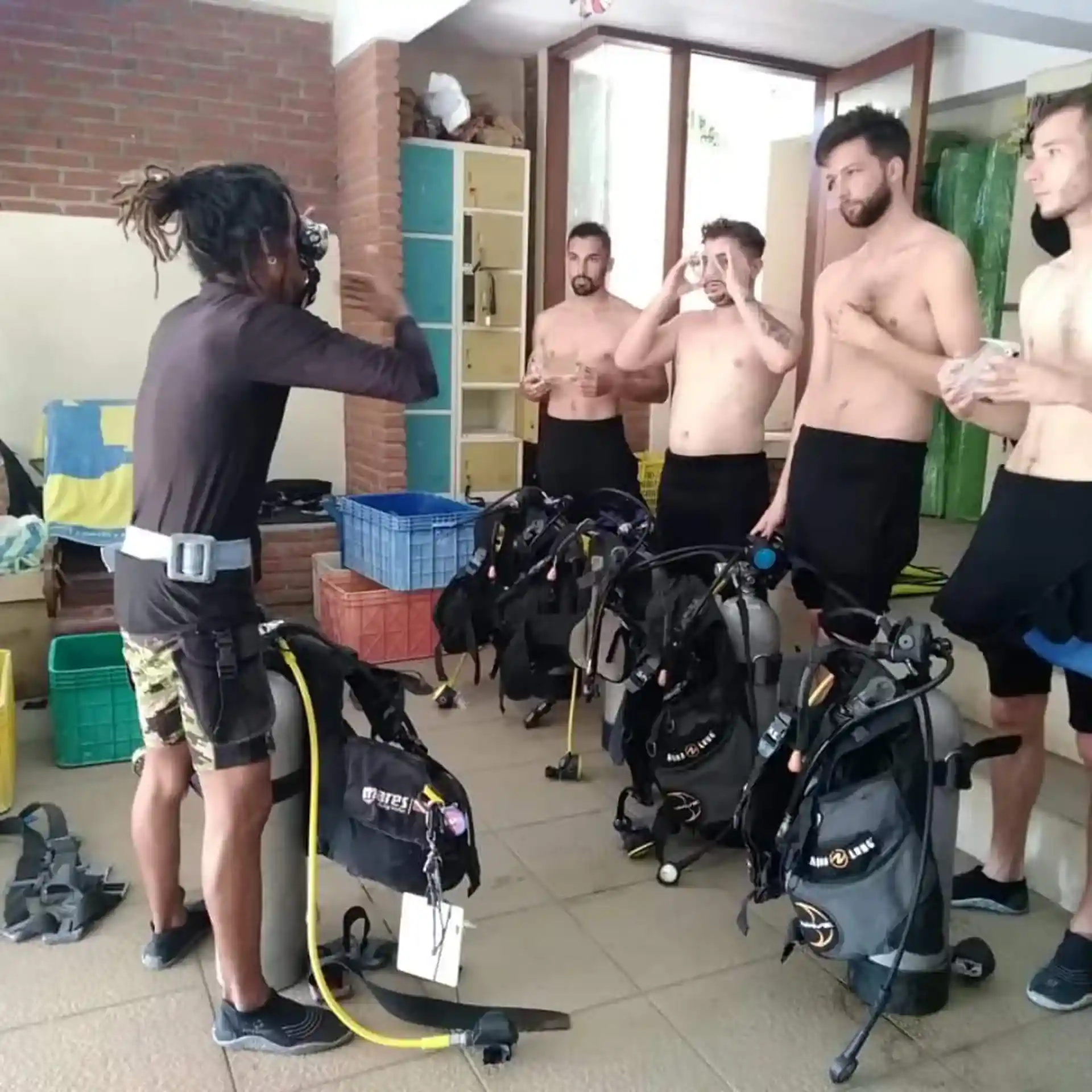 Our instructor give instruction for skill exercise and scuba equipment before practice in our swimming pool