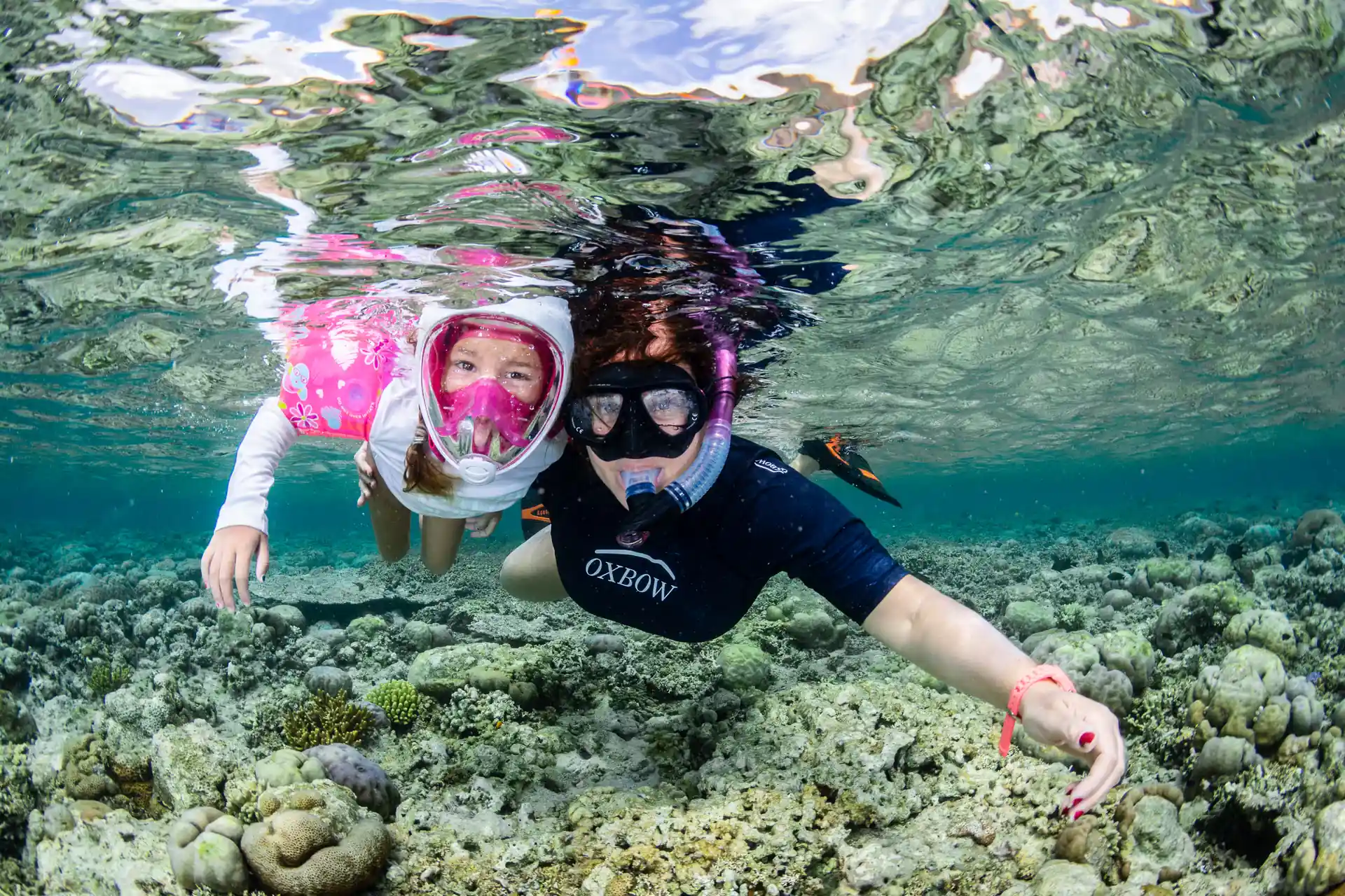 Mother and daughter snorkelling together