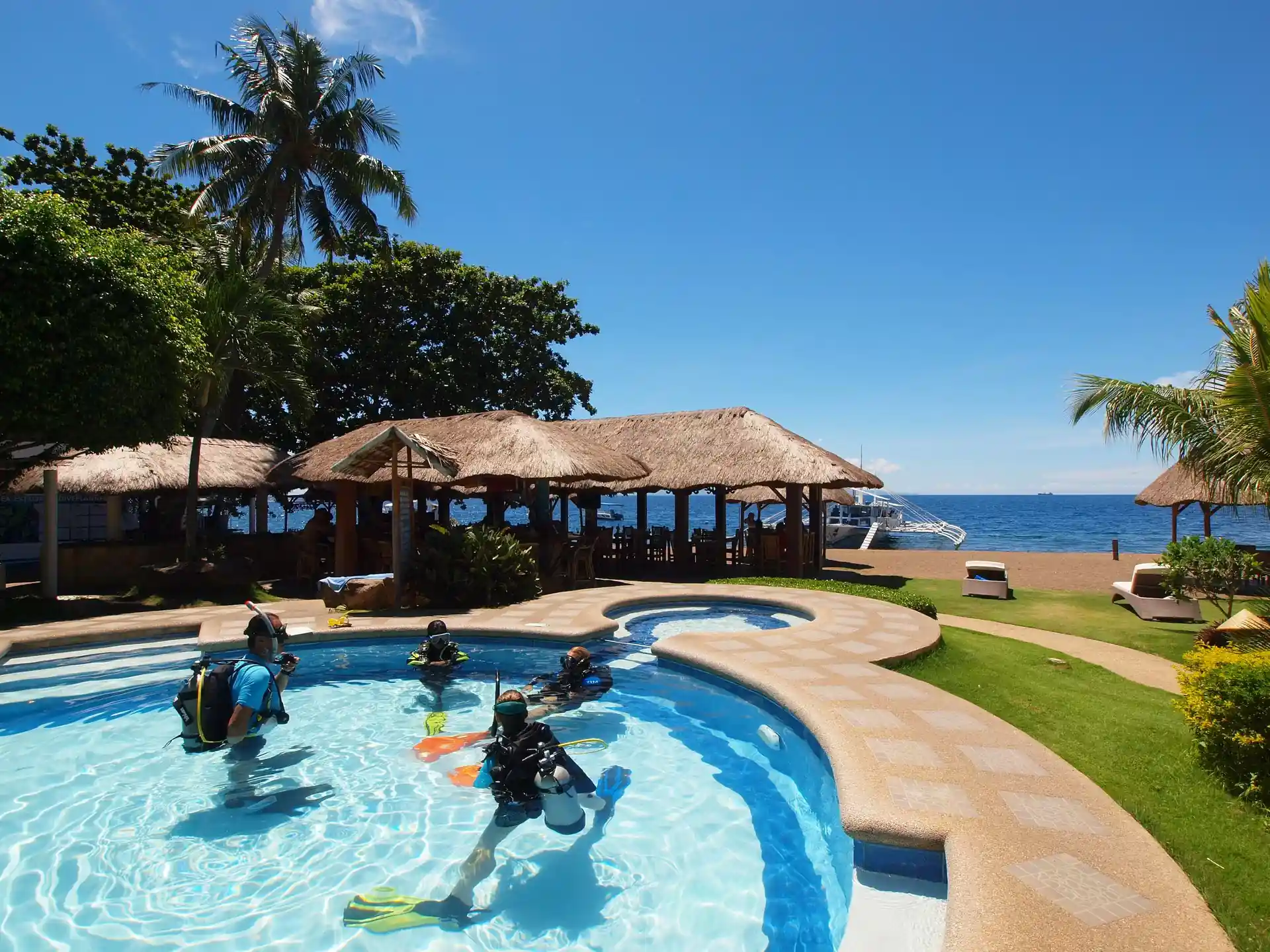 Explore the awe-inspiring world of SCUBA diving at Sea Explorer's in Dauin, Negros Oriental, Philippines. Witness the excitement of a discover scuba diver as they explore a vibrant tropical reef.