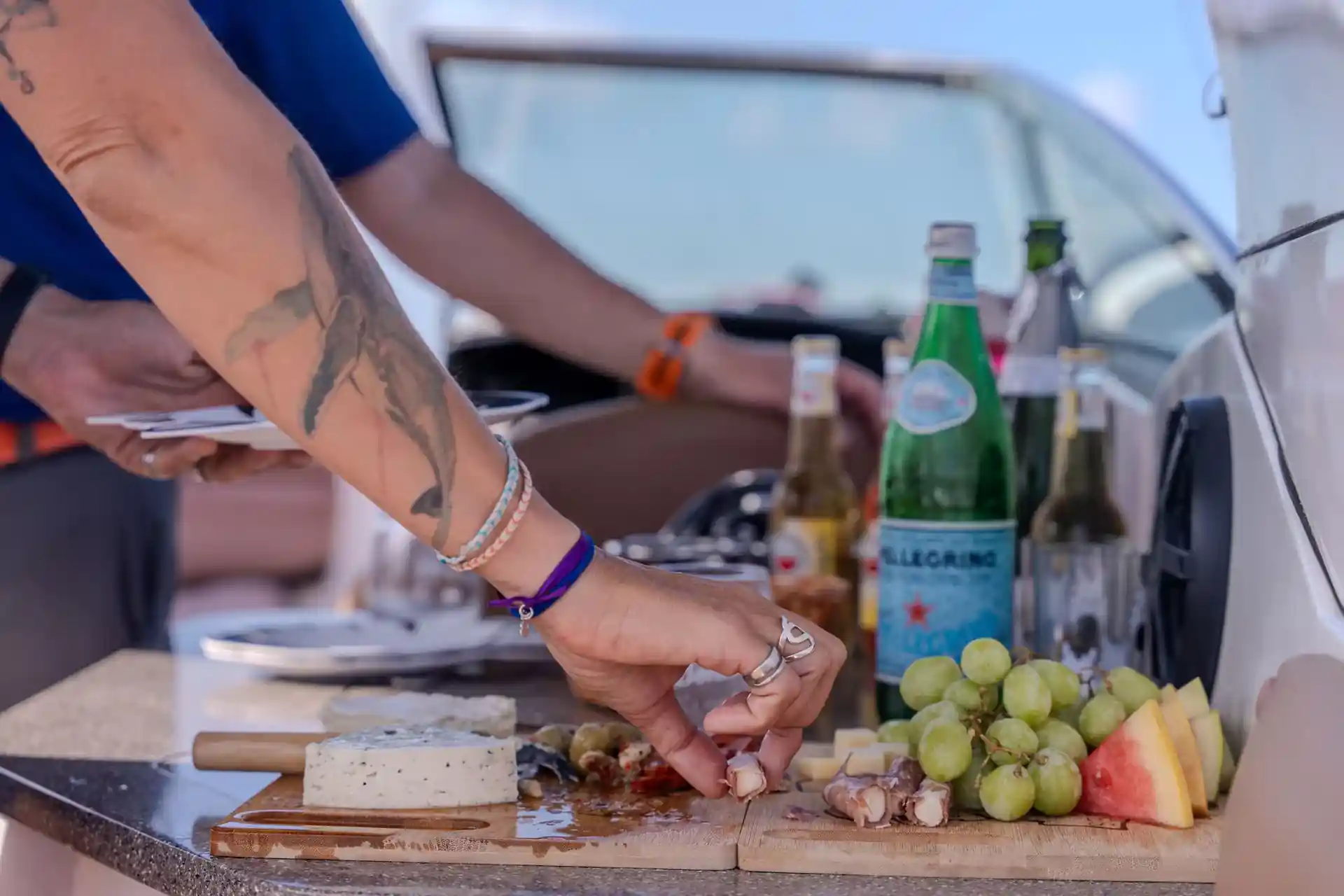 Post-dive bliss: gourmet charcuterie, ocean views, and total relaxation on deck.
