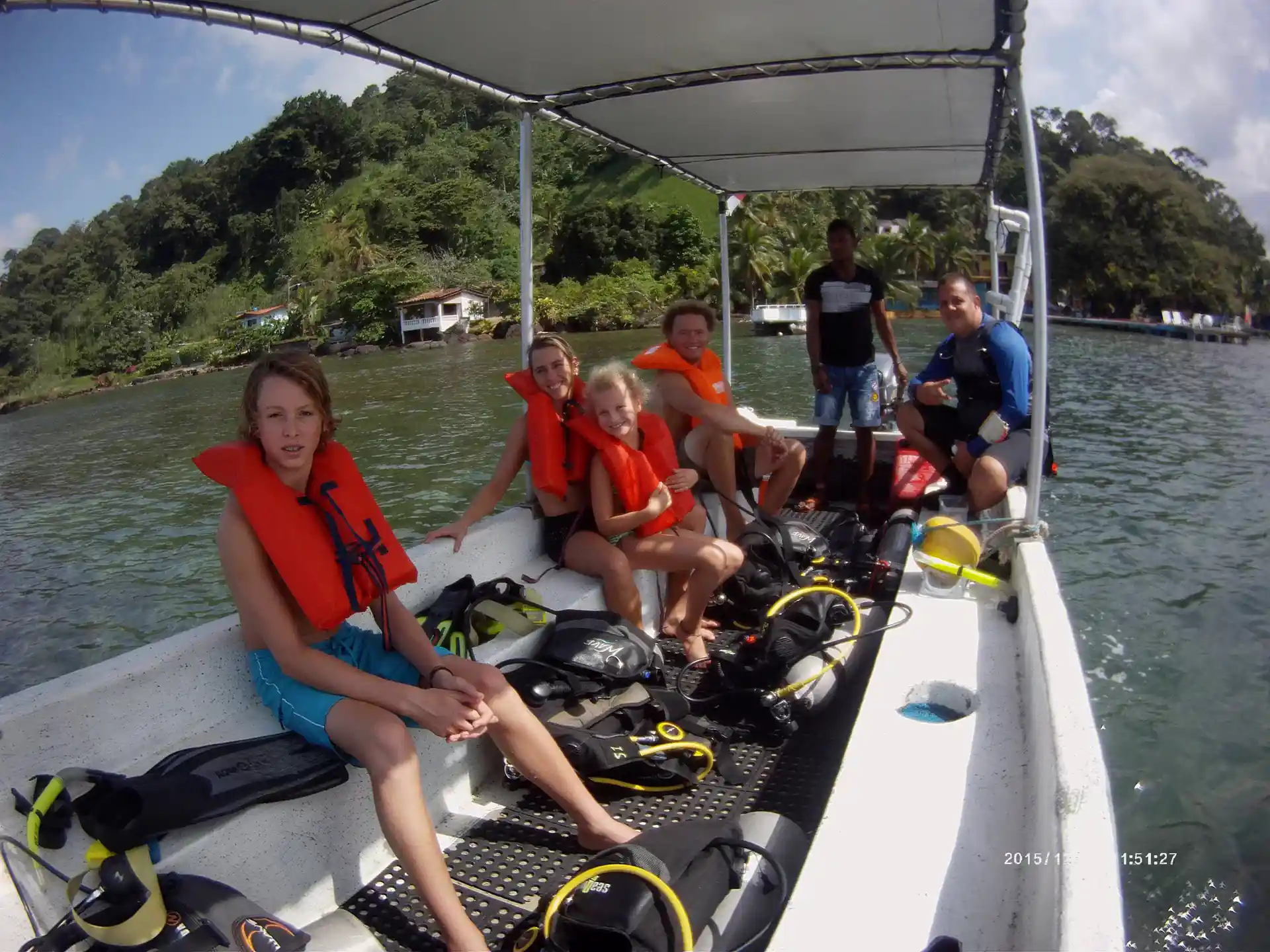 Family and staff on their boat ride to the diving place