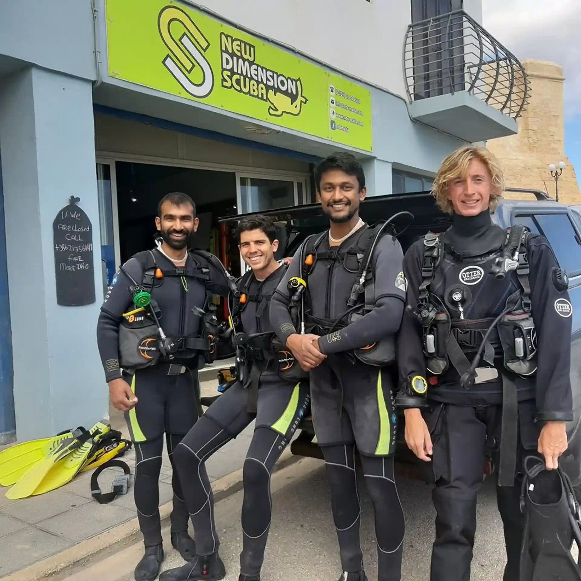 Group of Open Water Divers With Their Instructor