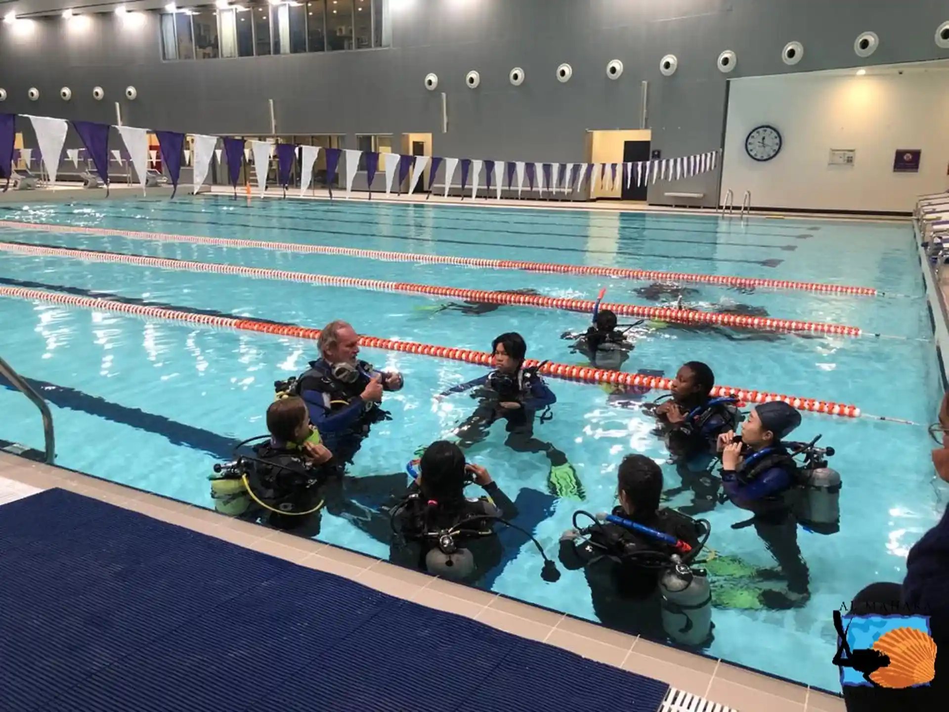The students are doing confined water skill with the Instructor