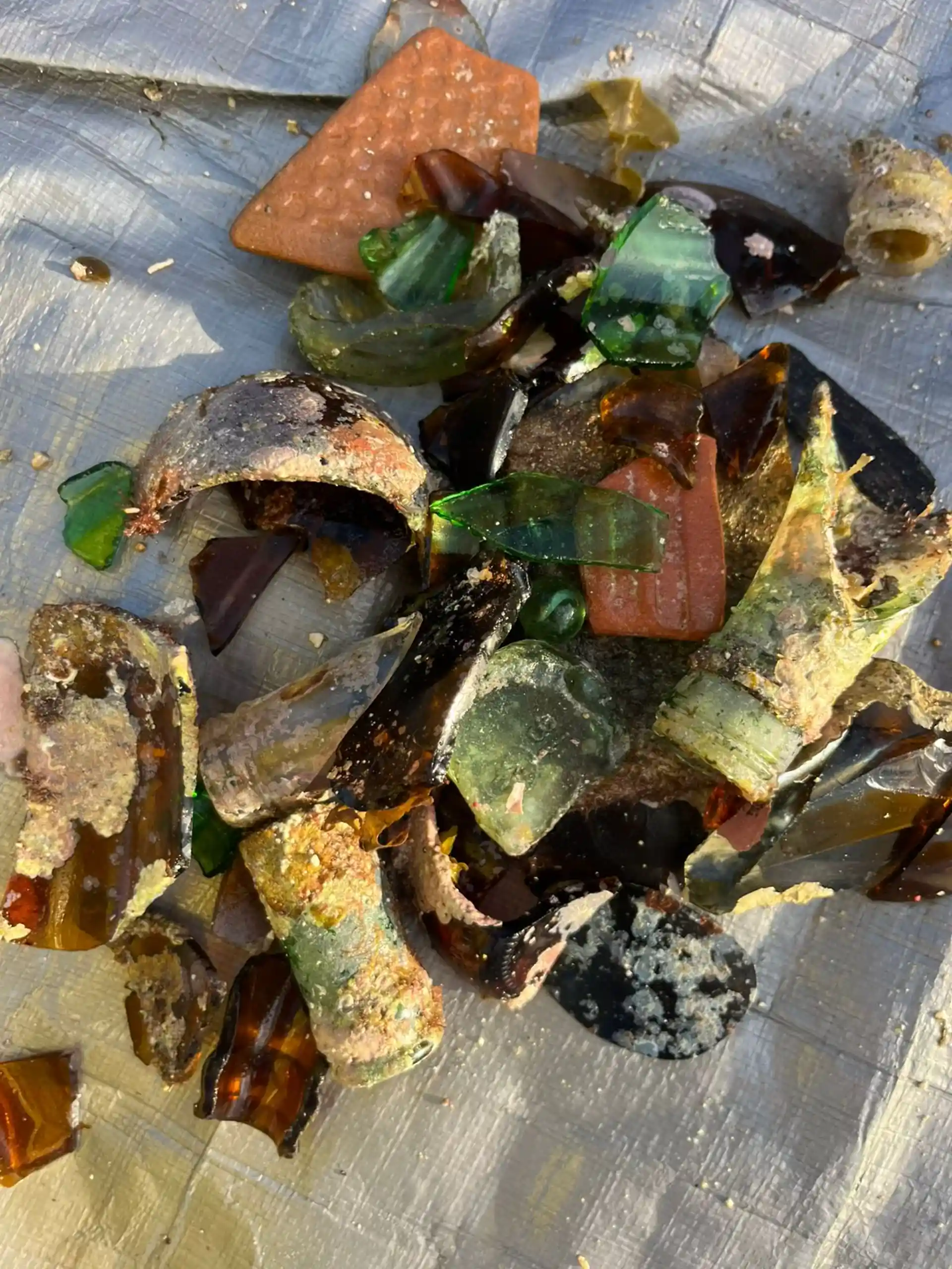 A collection of glass fragments removed from the ocean