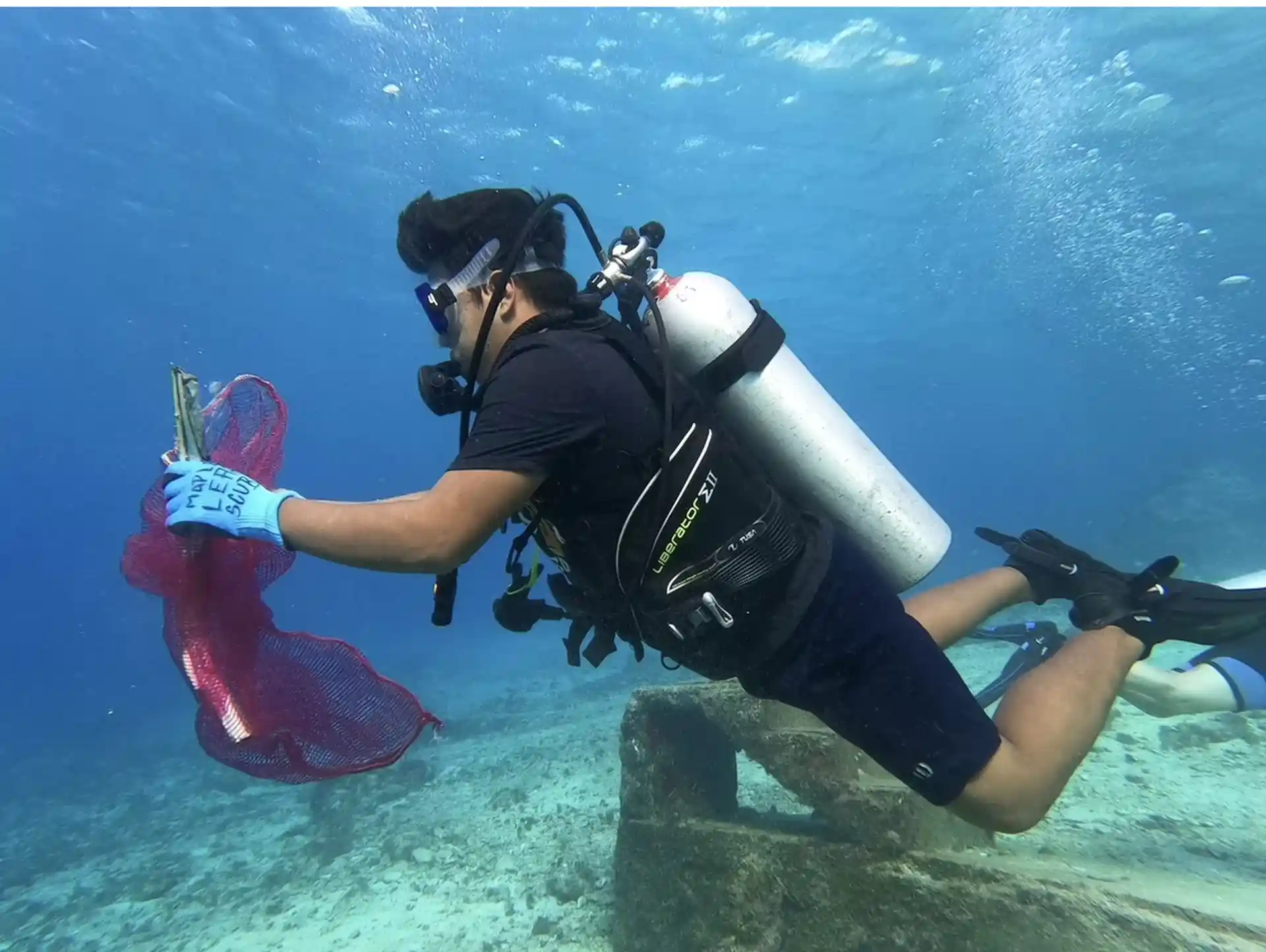 Local diver helping to keep the ocean clean!