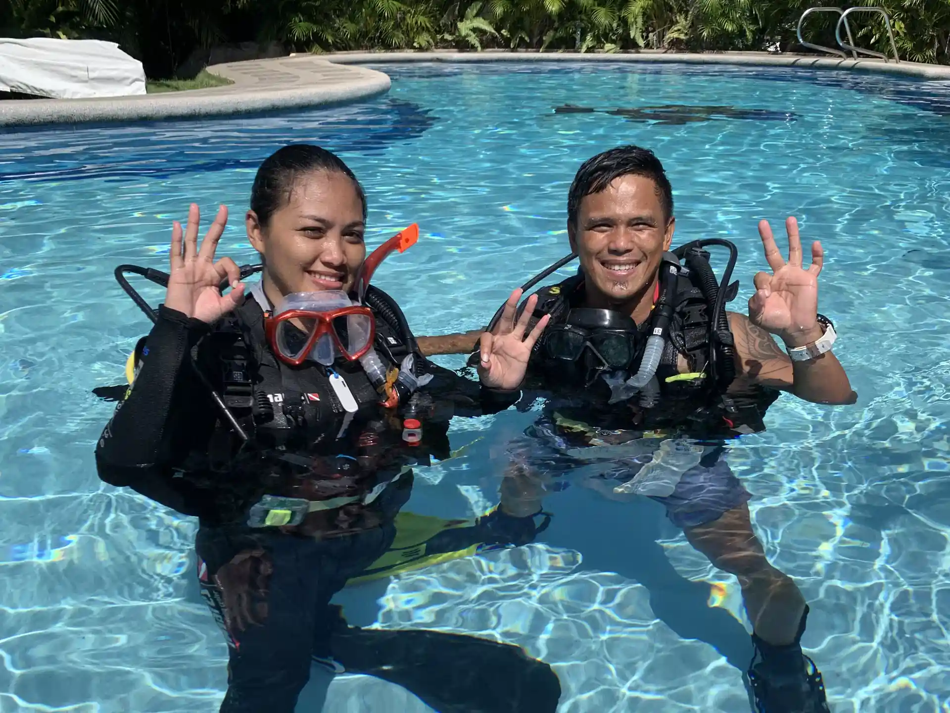 Discover the breathtaking world of SCUBA diving at Sea Explorer's in Dauin, Negros Oriental, Philippines. Witness the exhilaration of a discover scuba diver exploring a vibrant tropical reef.