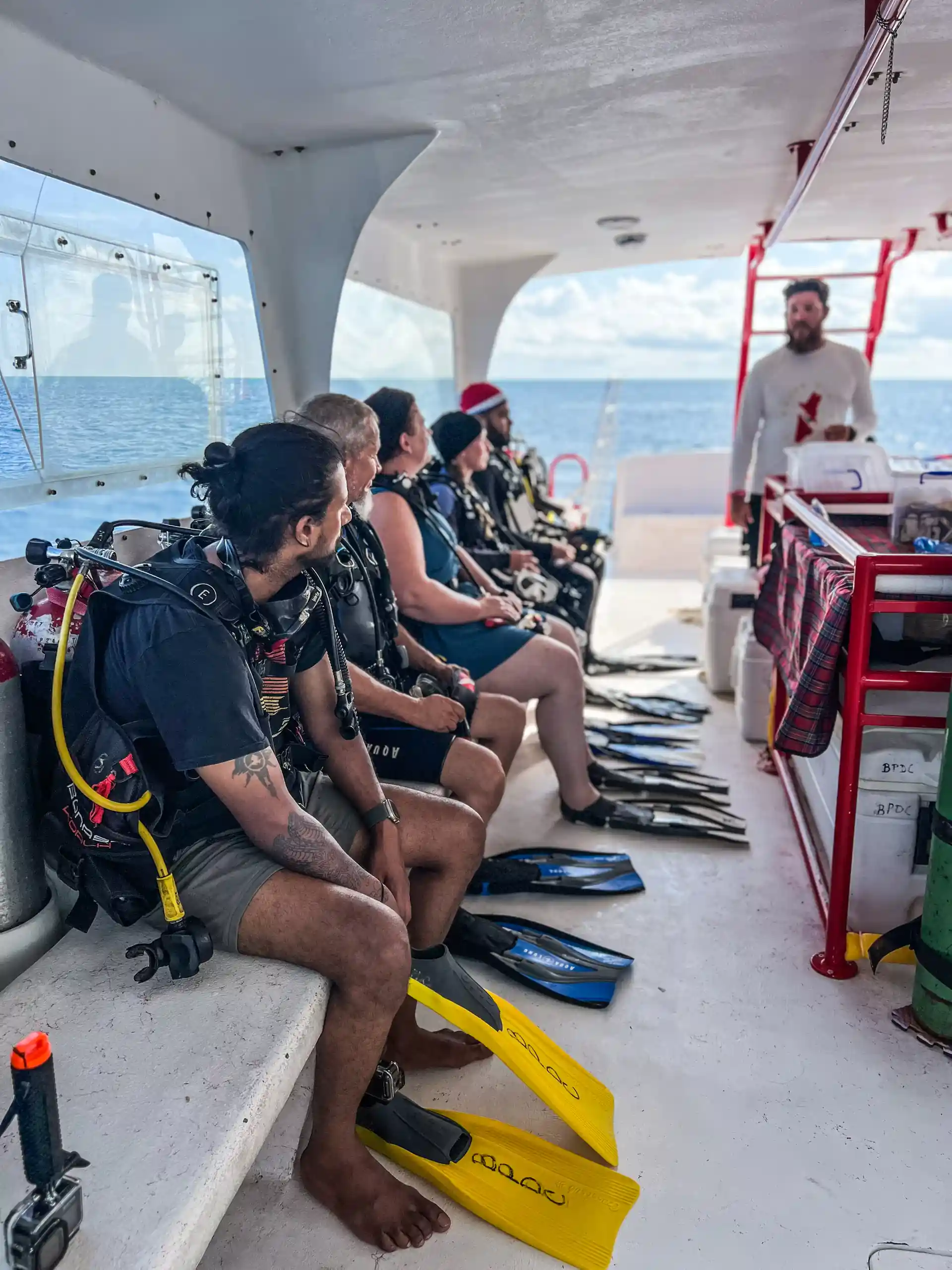 Certified Divers prepare to enter the dive at the second largest barrier reef here at San Pedro Ambergris Caye along with our PADI Dive Masters.