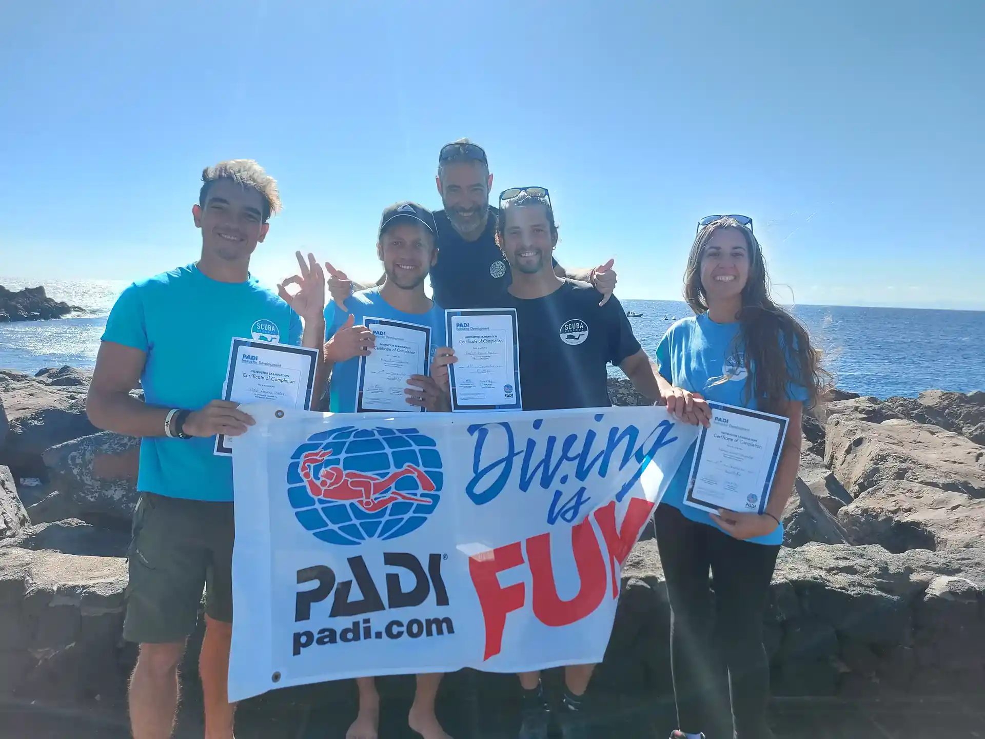 Happy new PADI Open Water Scuba Instructors upon successful completion of their Instructor Examination