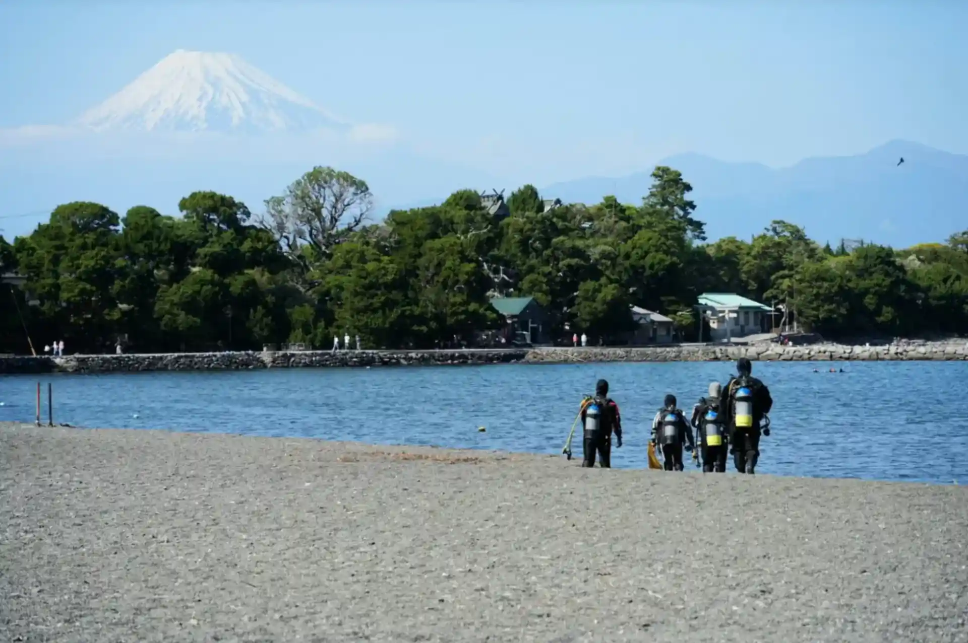 Enter the ocean with Mt. Fuji rising in the distance.